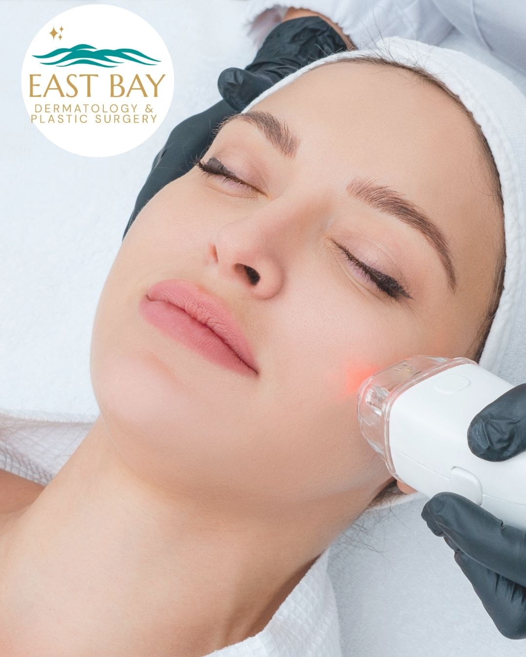 A person receives a facial laser treatment from a gloved professional. The East Bay Dermatology & Plastic Surgery logo appears in the top left corner.