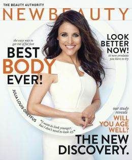 Julia Louis-Dreyfus wearing a white dress, smiling on the cover of NewBeauty magazine with headlines about body, aging, and beauty tips.